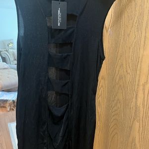 A black dress cut out slits in the front